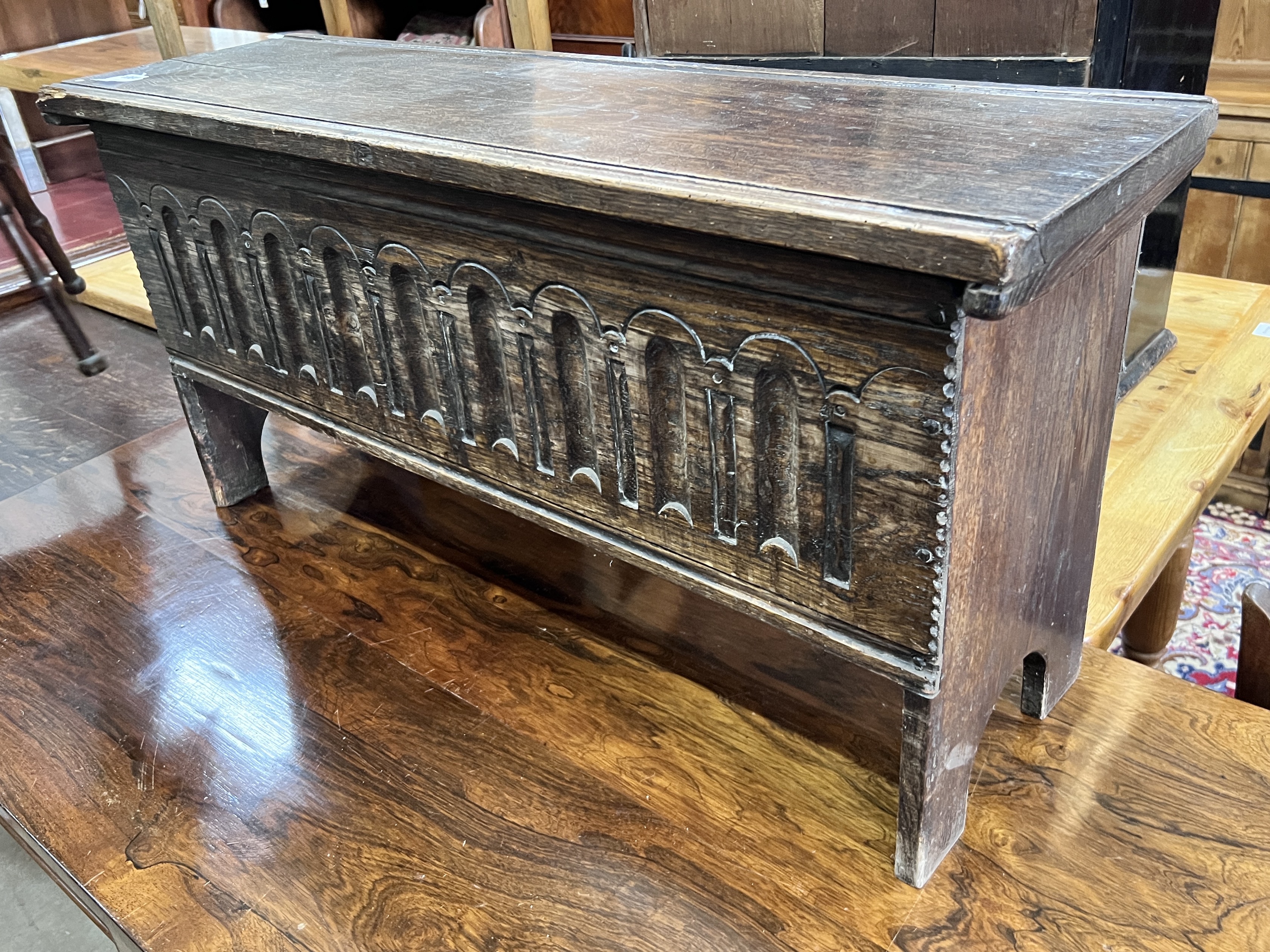 A 17th century style linenfold oak coffer, length 97cm, width 30cm, height 49cm